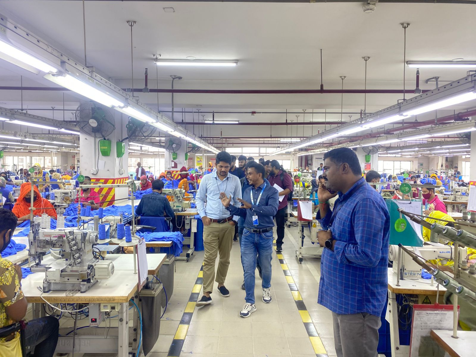 Team on a factory floor visit
